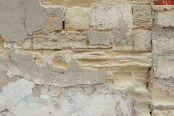 Wall fragment with scratches and cracks