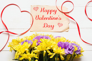 Happy Valentine's Day concept. Beautiful flowers on white wooden