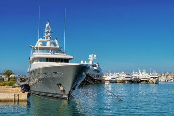 big luxury yacht moored in a marina in antibes, french riviera
