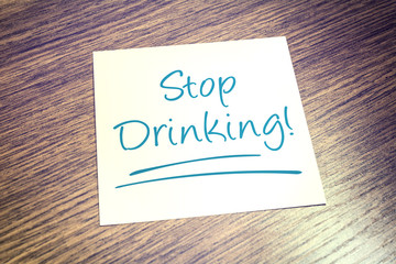 Stop Drinking Reminder On Paper On Wooden Table