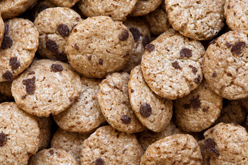 Background of chocolate chip cookies cereal from above.