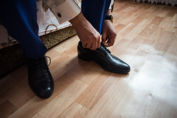 The man wears shoes.