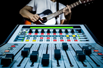 guitarist & recording mixer in studio, isolated on black for music background