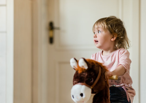 Child On Rocking Horse