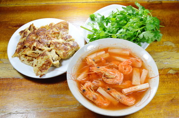 shrimp with coconut shoot sour and fried on table