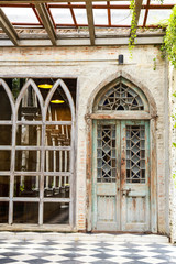 old wood door and a glass window  with wall covered