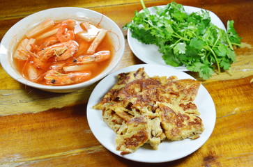 shrimp with coconut shoot sour and fried on table