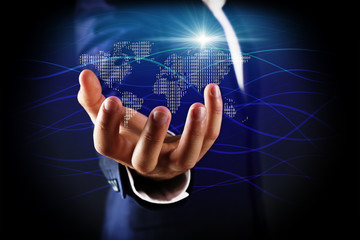 Businessman holding digital world map in hand. World map and binary code on digital display. Technology concept.