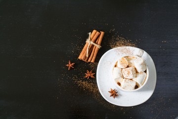 Cup of hot cocoa with marshmallows on the wooden table, top view,selective focus. Space for text