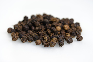 Black pepper, piper nigrum, isolated on white background