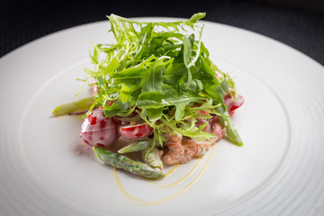 salad with arugula on white plate