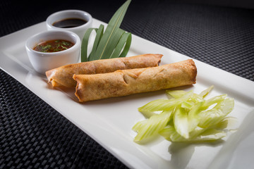 spring rolls with shrimp on white plate, restaurant