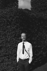 Male fashion concept. Handsome mature man with silver beard posi