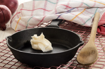 pork lard in a cast iron pan