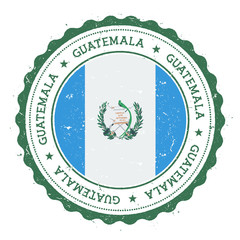 Grunge rubber stamp with Guatemala flag. Vintage travel stamp with circular text, stars and national flag inside it. Vector illustration.
