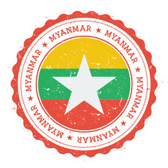 Grunge rubber stamp with Myanmar flag. Vintage travel stamp with circular text, stars and national flag inside it. Vector illustration.