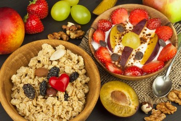 Healthy breakfast with cereals and colorful fruits. Yogurt with fruit and oatmeal. Meals for successful athletes. Food for kids.
