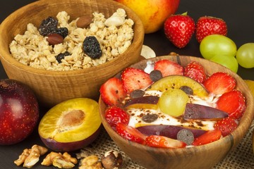 Healthy breakfast with cereals and colorful fruits. Yogurt with fruit and oatmeal. Meals for successful athletes. Food for kids.
