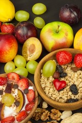 Healthy breakfast with cereals and colorful fruits. Yogurt with fruit and oatmeal. Meals for successful athletes. Food for kids.

