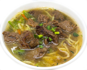 soup with meat and vegetables white background in the restaurant
