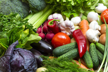 Background of fresh vegetables and greens closeup