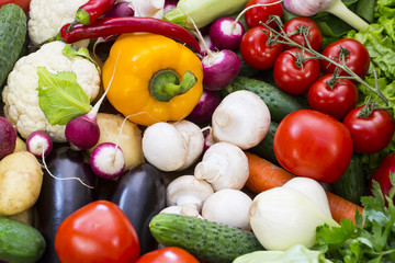 Fototapeta na wymiar Background of fresh vegetables and greens closeup