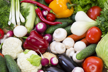 Background of fresh vegetables and greens closeup