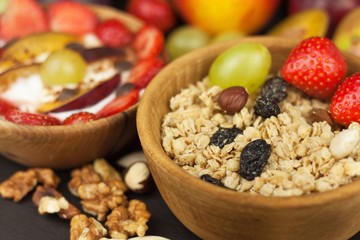 Healthy breakfast with cereals and colorful fruits. Yogurt with fruit and oatmeal. Meals for successful athletes. Food for kids.
