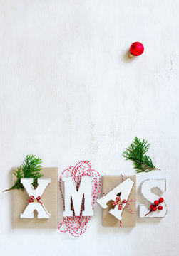 Xmas word on a wooden background