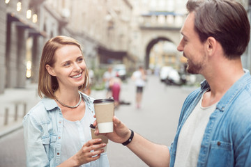 Cheerful friends drinking coffee