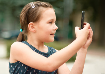 Girl is using smartphone