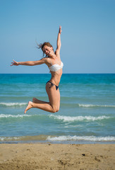 Cute brunette at the beach