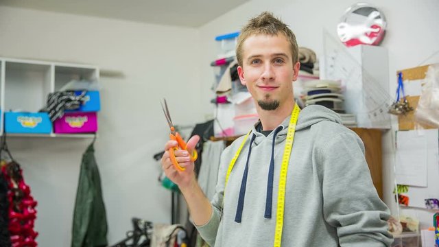 Male tailor prepare to work and smile in camera