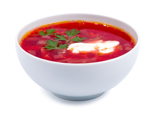 Hot borsch in a white bowl isolated on a white