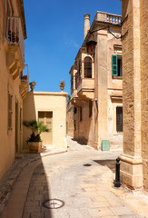 Fototapeta na wymiar The narrow street and residential houses of Mdina, the old capit