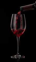 red wine pouring in glass