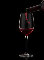 red wine pouring in glass