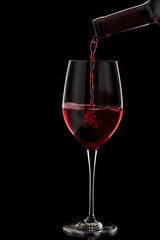 red wine pouring in glass