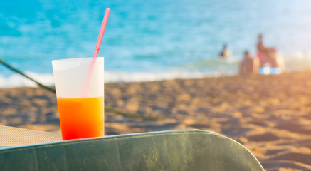 cold cocktail on sunbed at the beach