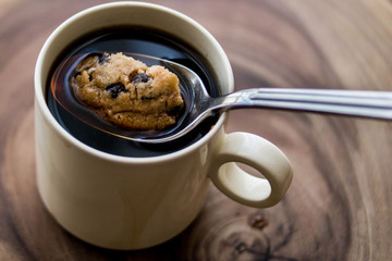 Chocolate Chip Cookie in the Coffee with Spoon.