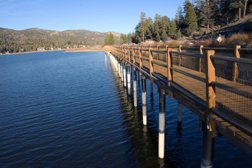 Naklejka premium Waterfront walkway at Sunset