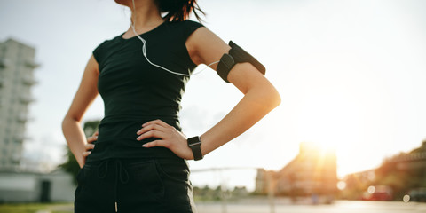 Urban runner outdoors in sunny morning