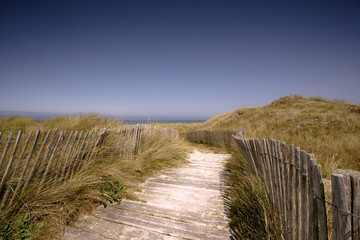 Fototapeta na wymiar Beach with Path and Fence in Brittany