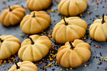 Fototapeta na wymiar Halloween pumpkin cookies - funny and healthy treats for kids