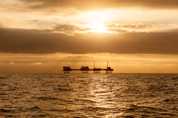 Fototapeta na wymiar Silhouette of offshore oil installation
