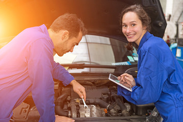 Team of mechanics working at the garage