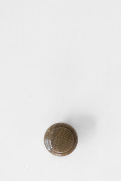 Close up of door knob on cabinet.