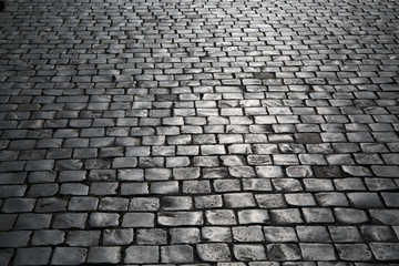 Texture of old cobblestone. City street.