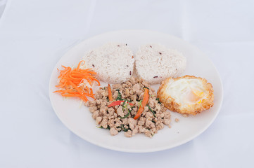 Rice topped with stir fried minced pork and basil
