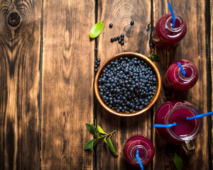 Blueberry juice . On wooden table.